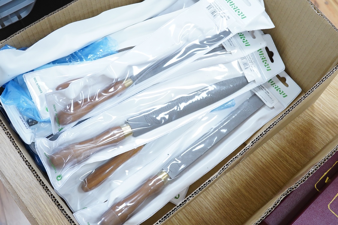 Thirty-three woodworking timber rasps by Auriou, including riffler rasps, taper rasps, square rasps, curved cabinet rasps, etc., all new in the original packets